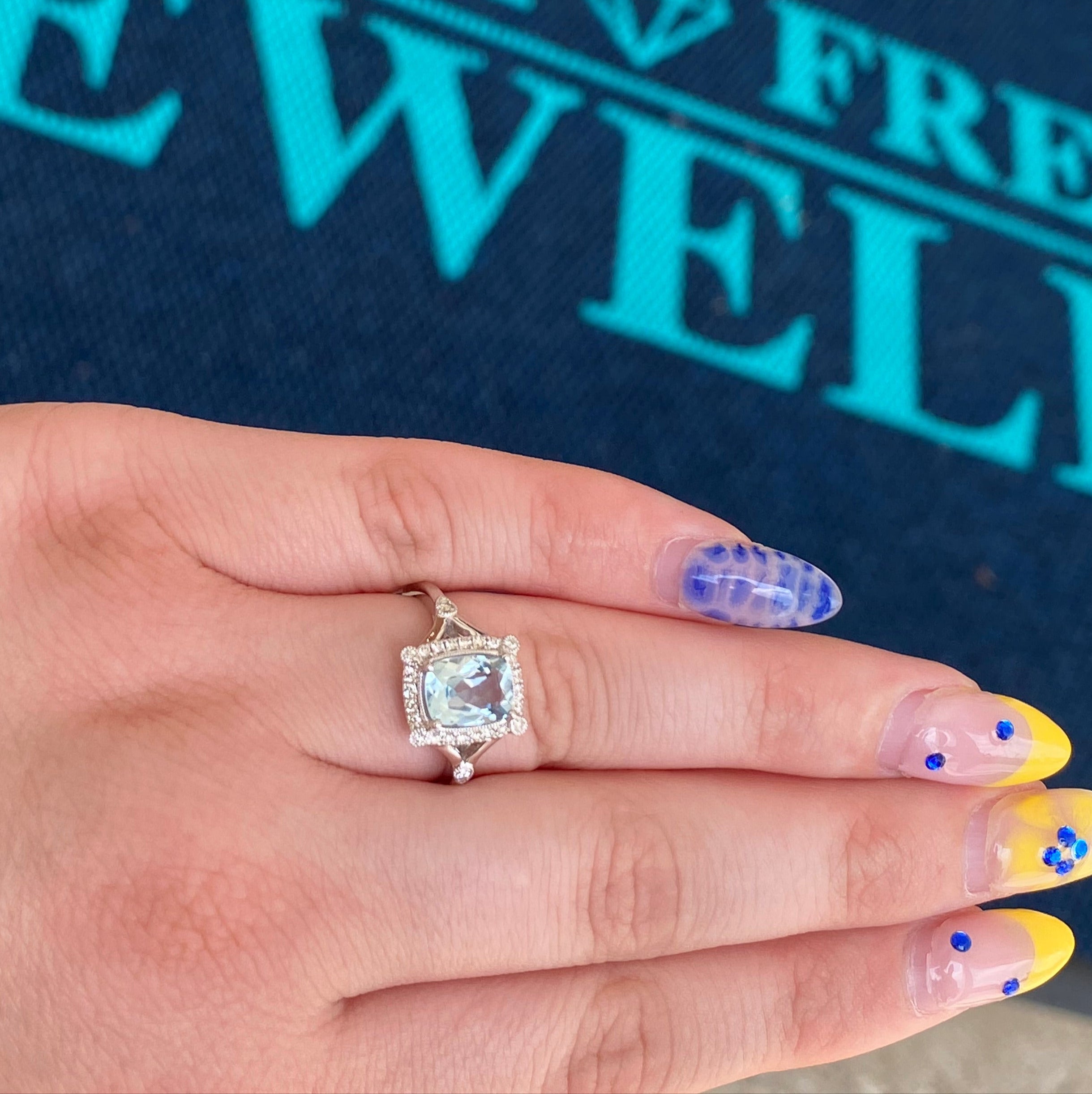 Aquamarine and Diamond Halo White Gold Ring